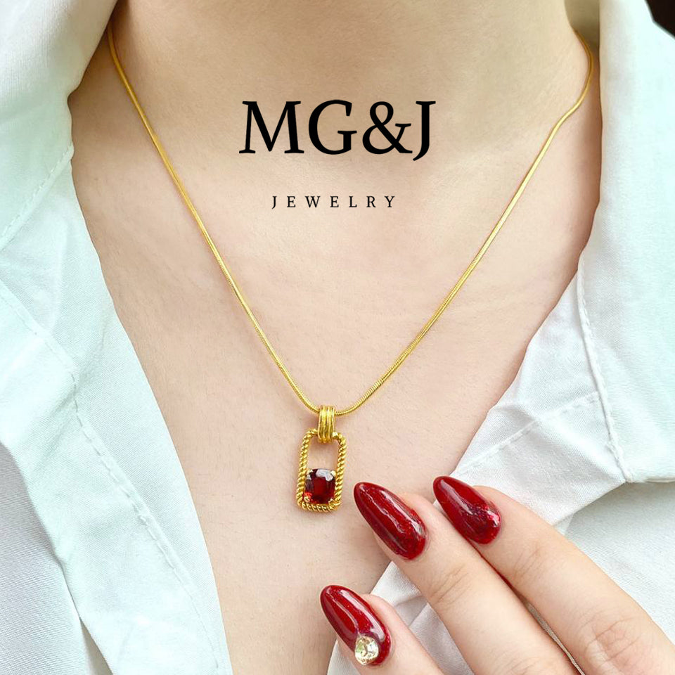 Classic Gold Frame & Garnet Pendant